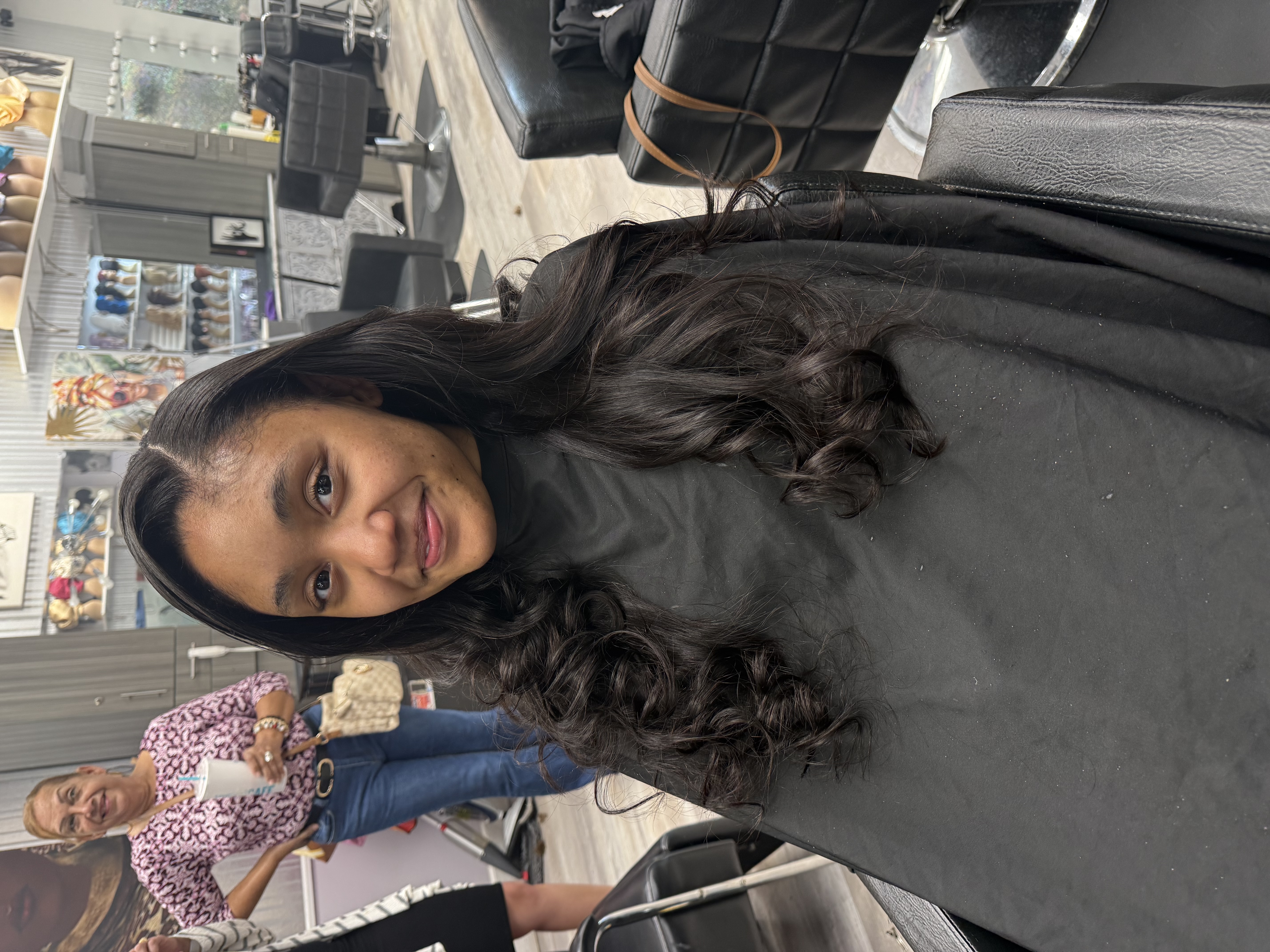 Client with long wavy styled hair