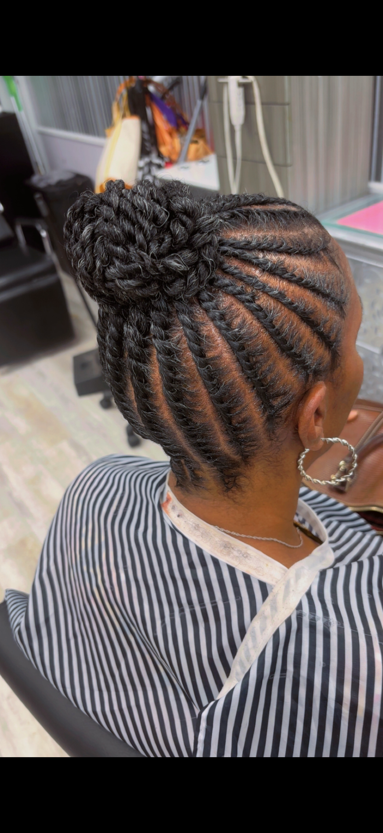 Flat twists gathered into a high bun