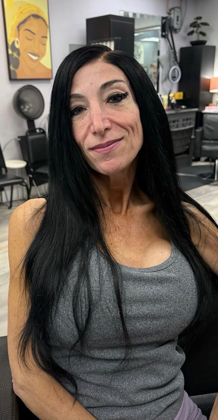 Client wearing a long sleek straight custom wig unit